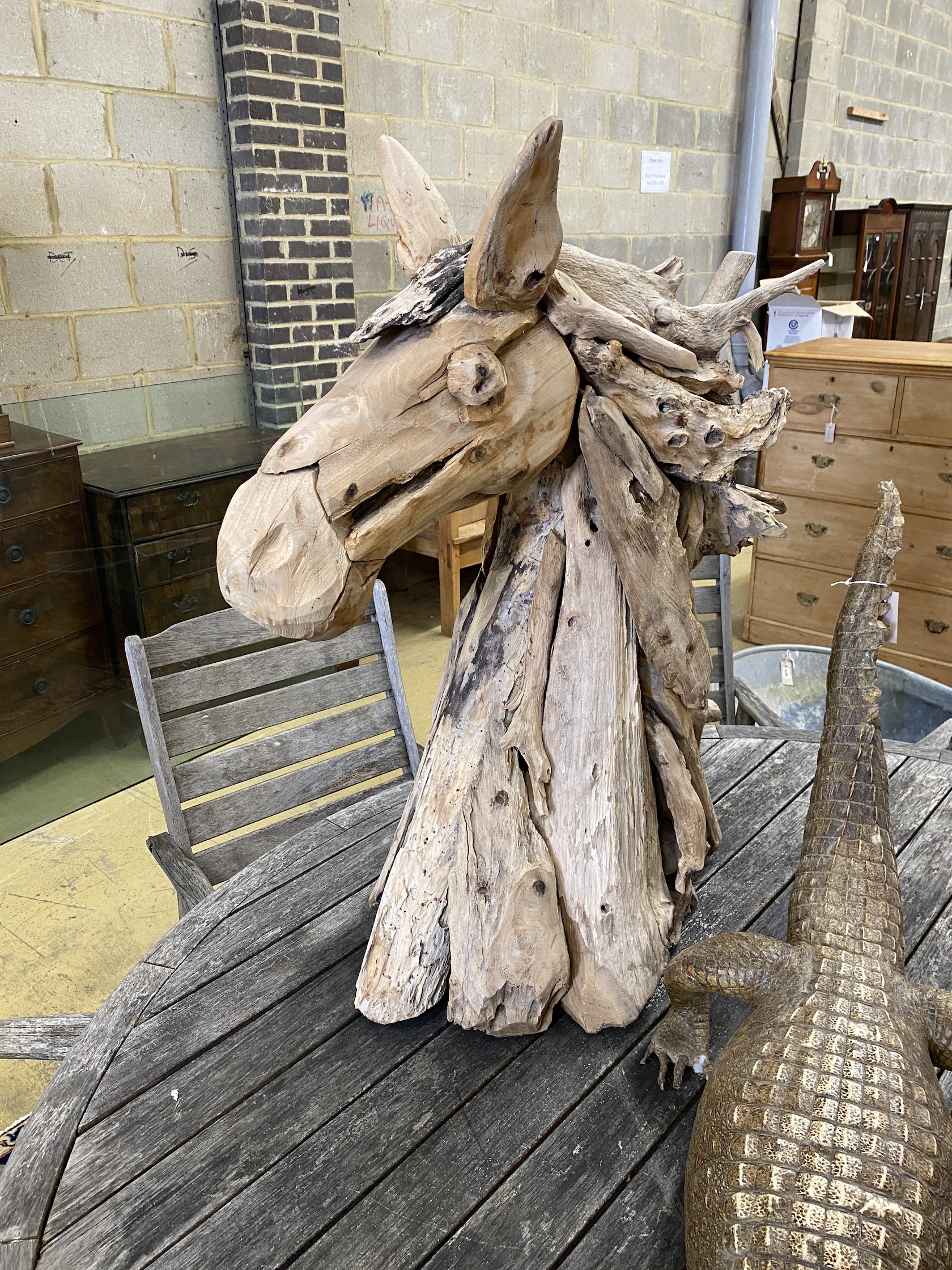 A carved driftwood horse head sculpture, height 98cm